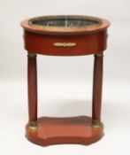 A FRENCH EMPIRE PAINTED AND ORMOLU MOUNTED OVAL JARDINIERE, with a lead trough, pair of column