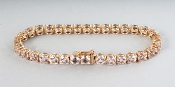 AN 18CT ROSE GOLD THIRTY-TWO STONE MORGANITE (16.65cts) LINE BRACELET.