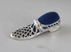 A SILVER LARGE SHOE PIN CUSHION. 1.5ins.