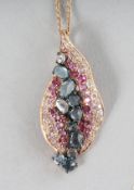 AN 18CT ROSE GOLD, AMETHYST, PERIDOT AND SWISS BLUE TOPAZ LEAF PENDANT on a chain.