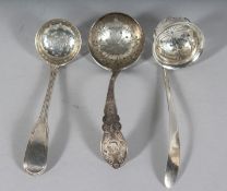 A GEORGE III FIDDLE THREAD SILVER SPOON, London 1803, and two others, Sheffield 1929 and 1926 (3).