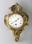 A SMALL 19TH CENTURY FRENCH LOUIS XVI DESIGN CARTEL CLOCK in an acanthus scrolled frame. 9ins long.