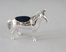 A SILVER HORSE PIN CUSHION. 1.5ins.