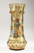 AN ITALIAN AMBER TINTED MOULDED GLASS VASE, enamel decorated with a classical figure. 10ins high.