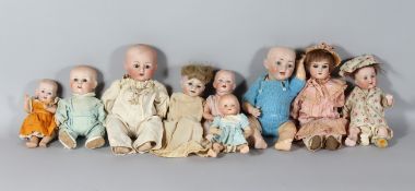 A COLLECTION OF NINE ANTIQUE DOLLS.
