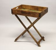 A HARROD'S TWO-HANDLED TRAY ON A STAND.