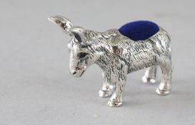 A SILVER DONKEY PIN CUSHION. 1.5ins.