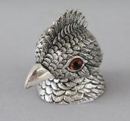A CAST SILVER PLATE COCKATOO INKWELL. 1.75ins.