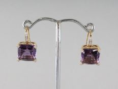 A GOOD PAIR OF 18CT GOLD, AMETHYST AND DIAMOND EARRINGS.