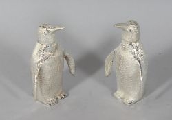 A PAIR OF SILVER PLATE PENGUIN SALT AND PEPPERS. 2.5ins high.