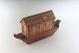 A NOAH'S ARK with a quantity of animals. 16ins long.