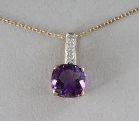 A 9CT GOLD, CUSHION CUT AMETHYST AND DIAMOND PENDANT on a chain.