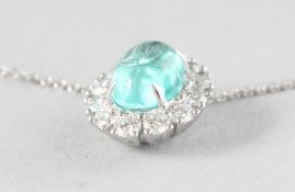A SUPERB 18CT YELLOW AND WHITE GOLD, PARAIBA TOURMALINE (1.53cts) AND CABOCHON DIAMOND (0.60cts)