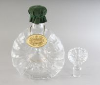 A BACCARAT CRYSTAL REMY MARTIN DECANTER AND STOPPER in a velvet box.
