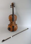 A CASED VIOLIN AND BOW in a case.