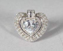 A SILVER CZ HEART SHAPED RING.