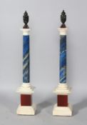 A FINE PAIR OF GRAND TOUR PIETRA DURA COLUMNS with Porphyry urn finials, on a black and white marble