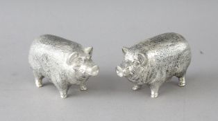 A PAIR OF CAST 800 PIG SALT AND PEPPERS. 2.5ins long.
