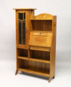 AN ART NOUVEAU OAK BUREAU BOOKCASE, with open shelves, a small drop flap, glazed door, on shaped