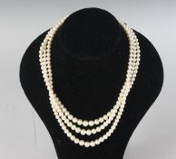 A TRIPLE ROW PEARL NECKLACE.