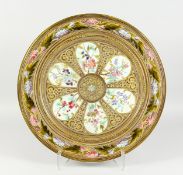 A GOOD LARGE CONTINENTAL CIRCULAR POTTERY CHARGER, in the manner of Zsolnay Pecs, Probably Mettlach,