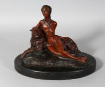 A BRONZE NUDE WITH A LEOPARD on an oval marble base. 11ins long.