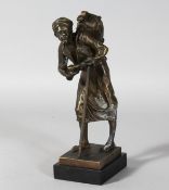 P. L. KAMROILEZ A BRONZE OF AN ARAB with a stick, signed.