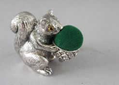 A SILVER SQUIRREL PIN CUSHION. 1.5ins.