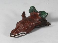A BRONZE FOX PAPER CLIP. 6ins long.