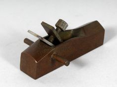A MINIATURE BRONZE PLANE. 3.25ins long.