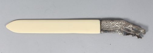 A SILVER HANDLE HORSES HEAD PAGE TURNER. 10.5ins long.