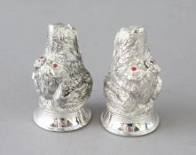 A PAIR OF CAST 800 HOUND DOG SALT AND PEPPERS. 2.5ins long.