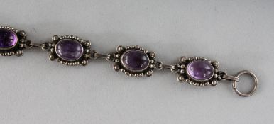 A SILVER AND AMETHYST BRACELET.
