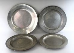 FOUR 17TH - 18TH CENTURY PEWTER CIRCULAR CHARGERS, one by Thomas King. 15ins, 16.5ins (2) and