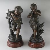 AFTER AUGUSTE MOREAU A GOOD PAIR OF BRONZED SPELTER FIGURES OF A YOUNG BOY AND GIRL. Signed, on