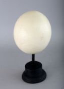 AN OSTRICH EGG on a stand. 5ins.