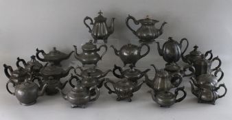 A COLLECTION OF TWENTY-FOUR PEWTER TEAPOTS.