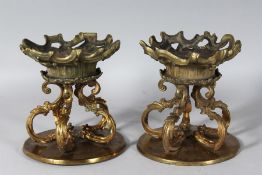 A PAIR OF 19TH CENTURY FRENCH GILT CIRCULAR STANDS. 7.5ins high.