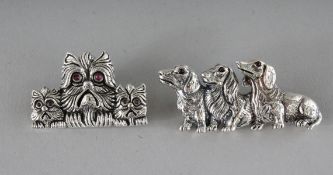 TWO NOVELTY SILVER DOG BROOCHES.