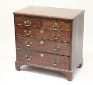 A GEORGE III MAHOGANY BACHELORS CHEST, with brushing slide, two short and three long graduated