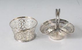A CIRCULAR SILVER PIERCED BASKET, 3ins diameter, London 1951, and a pierced basket, Chester 1940 (