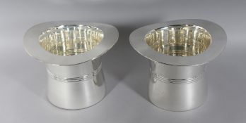 A PAIR OF SILVER PLATE TOP HAT WINE COOLERS. 7ins high.
