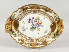A VERY GOOD MEISSEN OVAL TWO-HANDLED TRAY, with gilt entwined dolphin handle, the border with