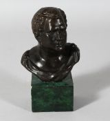 A BRONZE GRAND TOUR BUST on a marble plinth. 7ins overall.