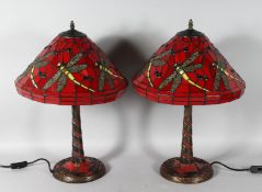 A GOOD PAIR OF TIFFANY DESIGN RED DRAGONFLY LAMPS. 22ins high.