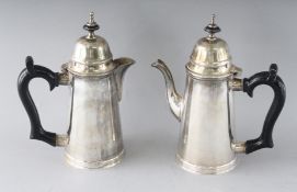 A PAIR OF TAPERING COFFEE POTS.