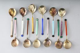 A SET OF TWELVE DAVID ANDERSON OF OSLO SILVER AND COLOURED ENAMEL SPOONS, cased.