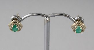 A PAIR OF 9CT GOLD EMERALD EARRINGS.