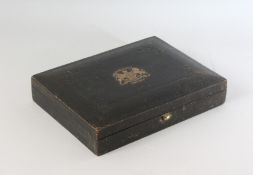 A LEATHER LETTER BOX, with gilt monogram and HER MAJESTY ROYAL COAT OF ARMS. 11.5ins.