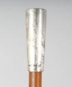 A GOOD RHINO HORN STICK with silver top, later engraved. 36ins long.
